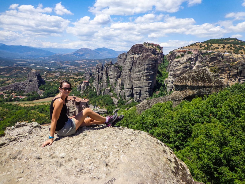 Anna sitting on a rock in Meteora Greece